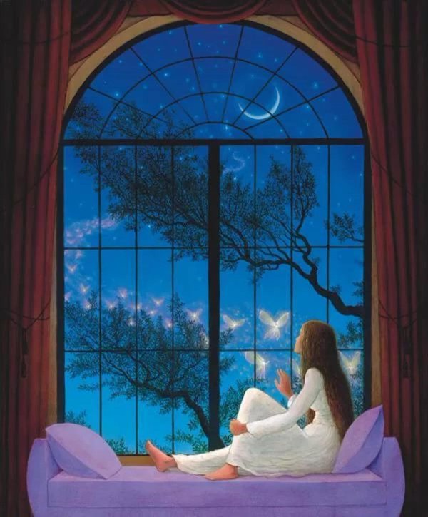 Девушка вечером у окна