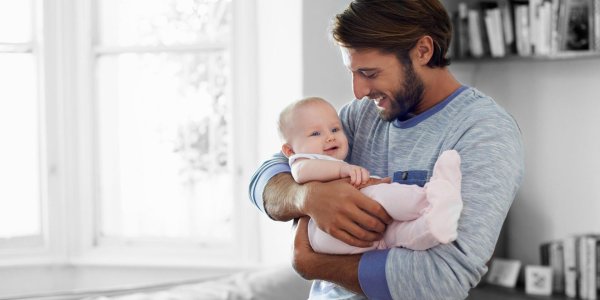 man holding baby