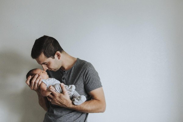 man holding baby