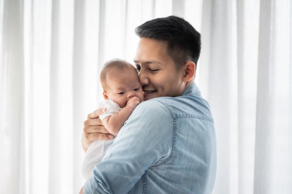 man holding baby