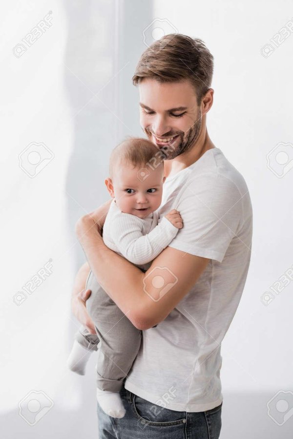 man holding baby